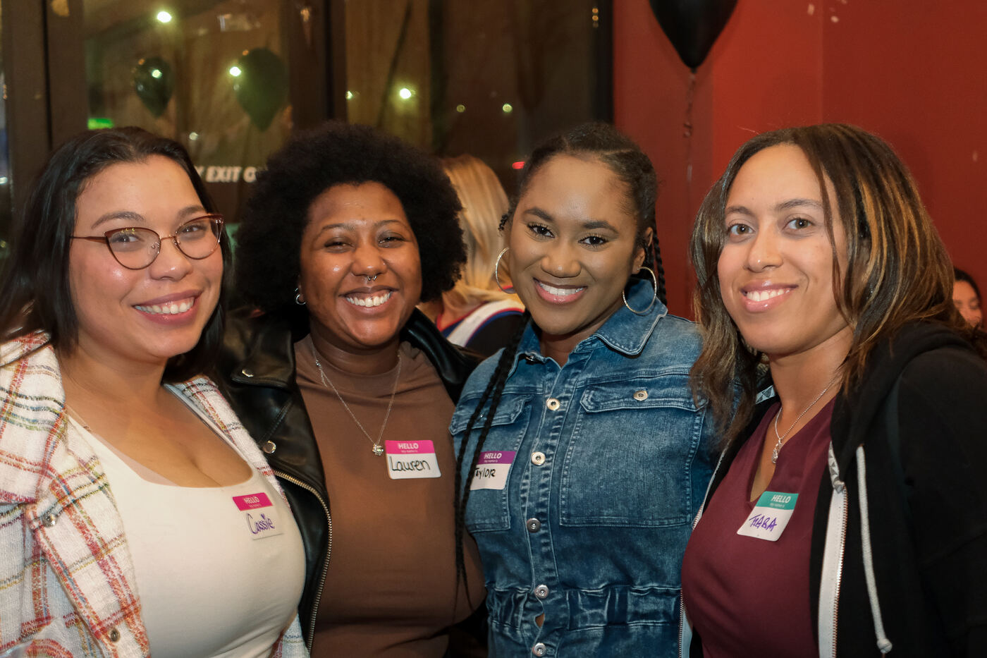 Cassie, Lauren, Taylor and Tiara smiling at a Social Spark event