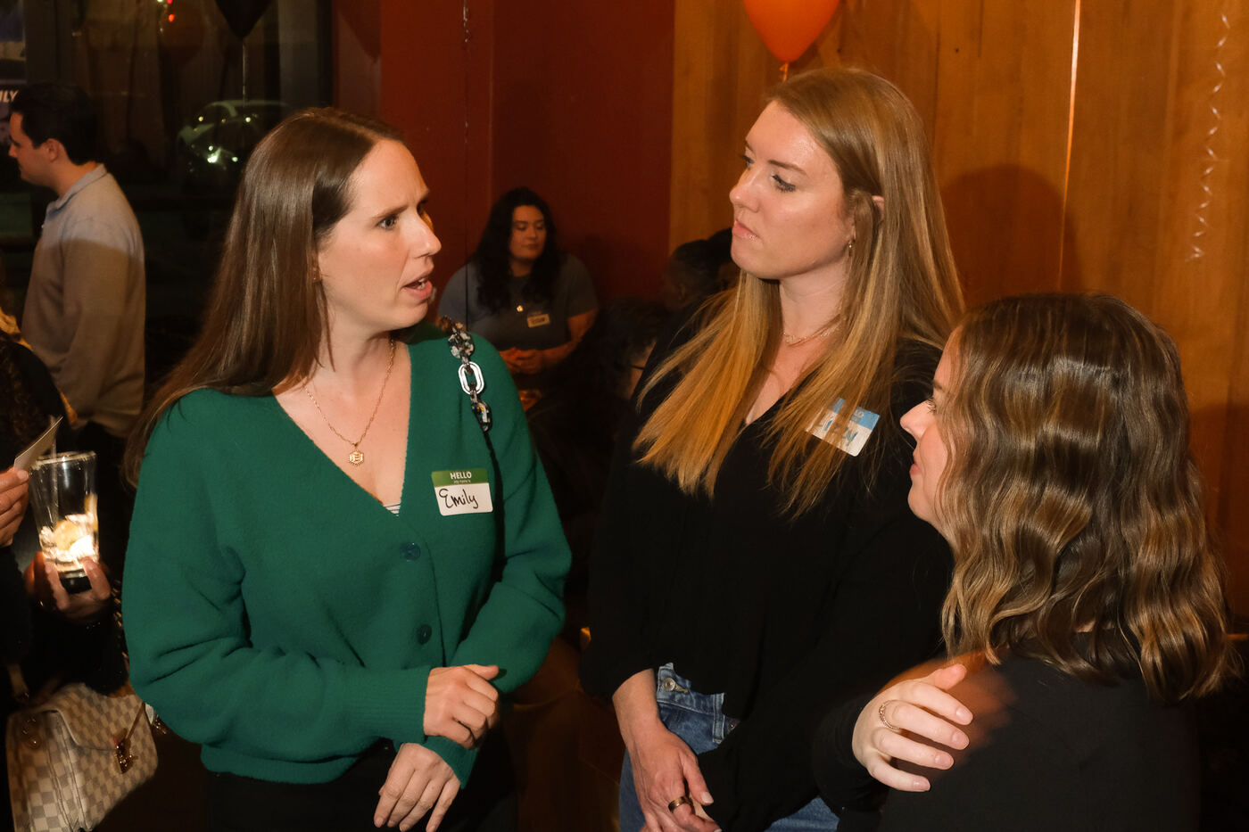 Emily and friends talking at a Social Spark event